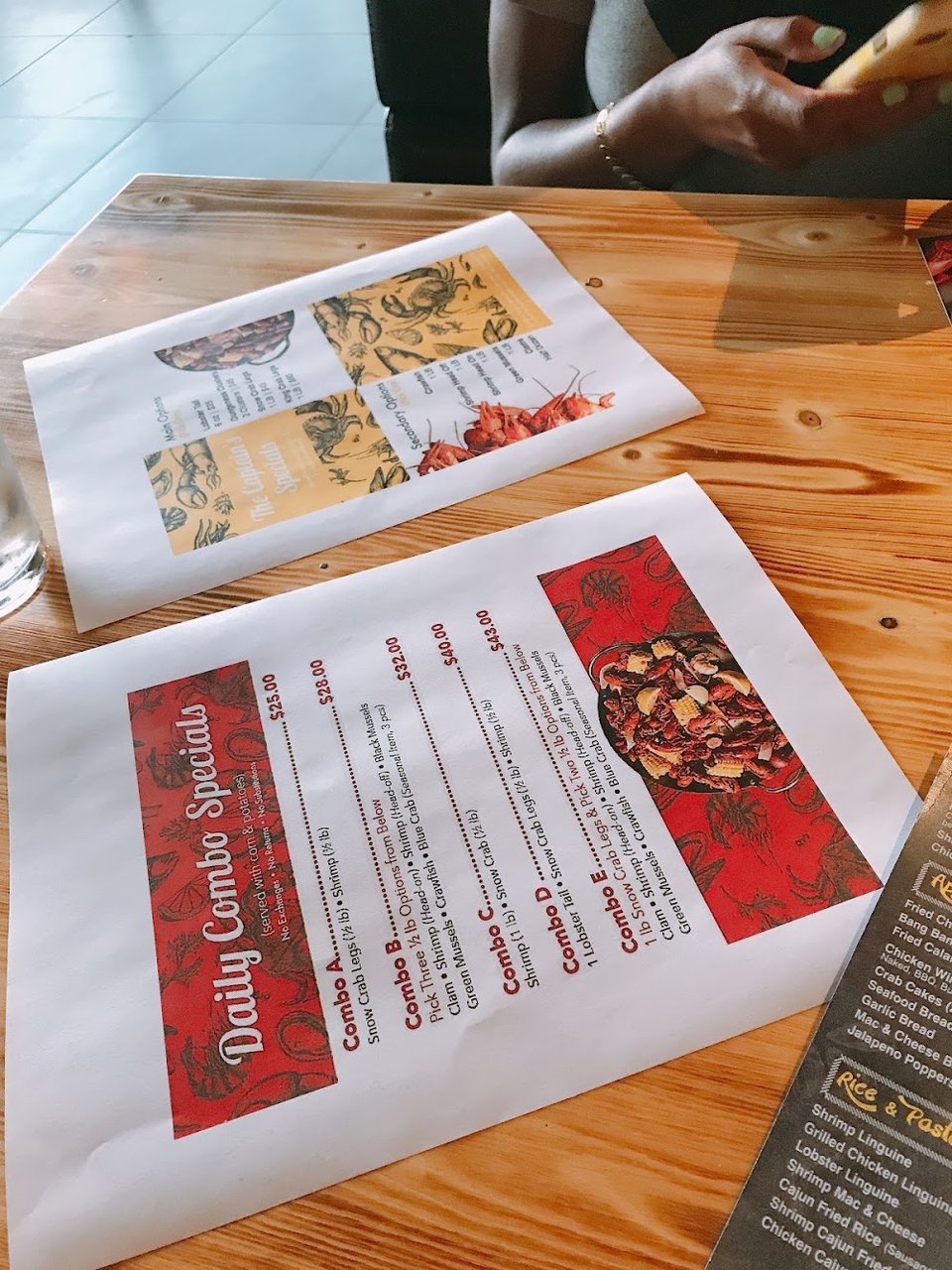 Close-up of a seafood restaurant menu.